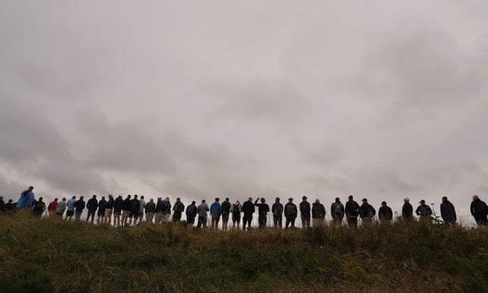 Spectators line up to watch Tiger Woods on the 6th tee.