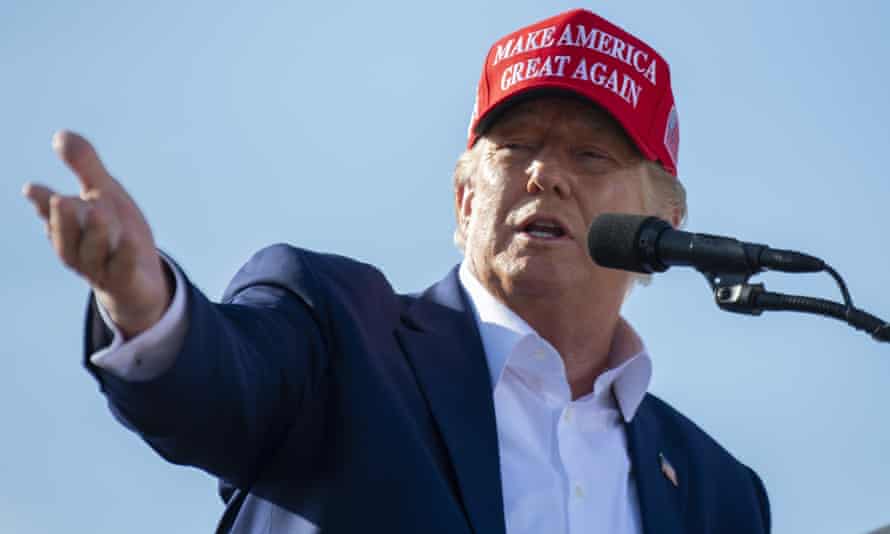 Former President Donald Trump speaks from the podium during a rally, Sunday, May 1, 2022, in Greenwood, Neb.