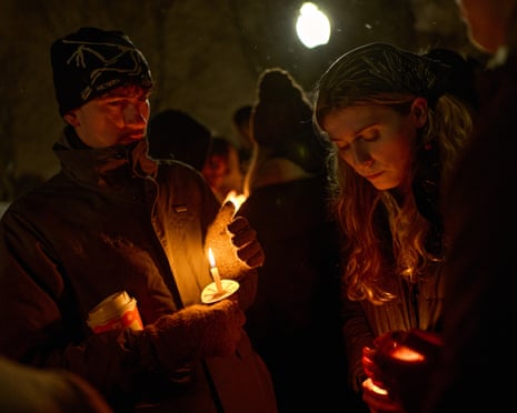 Brown University students participate in a candlelight vigil