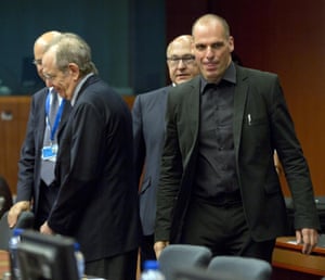 Greek Finance Minister Yanis Varoufakis, right, and French Finance Minister Michel Sapin, second right, arrive for a meeting of eurogroup finance ministers in Brussels on Saturday, June 27, 2015. Anxiety over Greece’s future swelled on Saturday after Prime Minister Alexis Tsipras’ call to have the people vote on a proposed bailout deal increased the risk that the country might fall out of the euro. (AP Photo/Virginia Mayo)