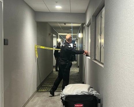 Police tape off hotel rooms where a person of interest was arrested in Rhode Island