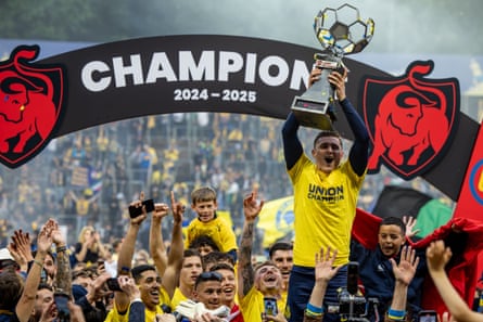 Union Saint-Gilloise supporters and players celebrate their long-awaited triumph