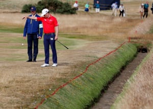Zach Johnson of the U.S. takes a penalty drop during the third round.