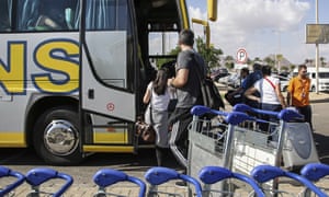British tourists board a coach to return to a hotel after it was announced there would be no more evacuation flights departing from Sharm el-Sheikh airport on Friday.