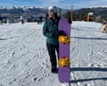 A person holding a Whitespace AMF Twin snowboard
