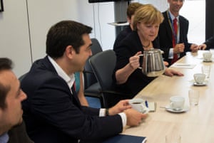 Greek Prime Minister Tsipras and German Chancellor Merkel attend a meeting prior to a euro zone leaders summit in Brussels