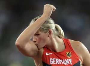 Müller shows some appreciation to her arms which helped her to a bronze medal