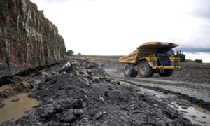 A Caterpillar Inc. truck moves across a mine