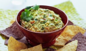 Bowl of guacamole and chips, close-up
