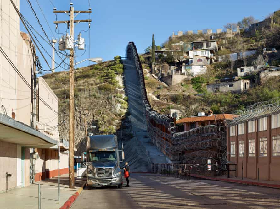 'My neighbourhood is being destroyed to pacify his supporters': the race to complete Trump's wall - The wall cuts between buildings at the US/Mexican border, Nogales, Arizona