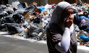 A woman covers her nose