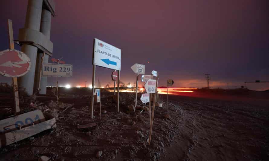 There are signs for oil and gas companies along the roads in Añelo, Neuquen, Argentina.