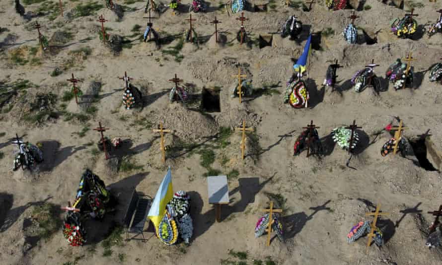 Russia-Ukraine war latest: Zelenskiy accuses west of lacking unity; Russia scraps upper age limit for soldiers – live - Breaking News Tombs of people who died after Russia invasion are seen in Bucha cemetery, outskirts of Kyiv, Ukraine.