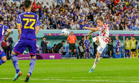 Luka Modric takes a shot from distance.