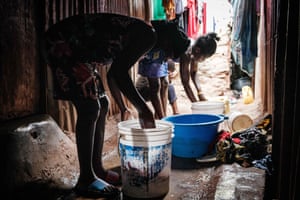 Why Covid school closures are making girls marry early - Linet (L), 16, who is about 3 months pregnant, helps to wash clothes.