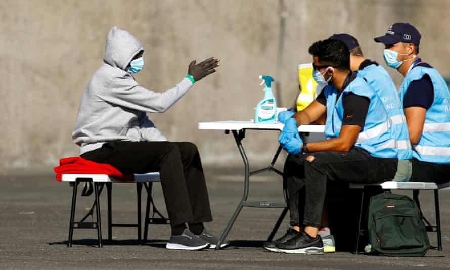 A migrant is interrogated by Frontex officials on the Spanish island of Gran Canaria.