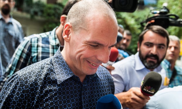 Outgoing Greek finance minister Yanis Varoufakis surrounded by media as he leaves from his house in Athens.