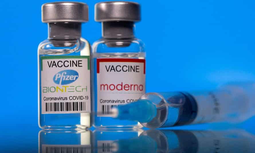 Pfizer-Vials labeled with BioNTech and Moderna coronavirus vaccines.