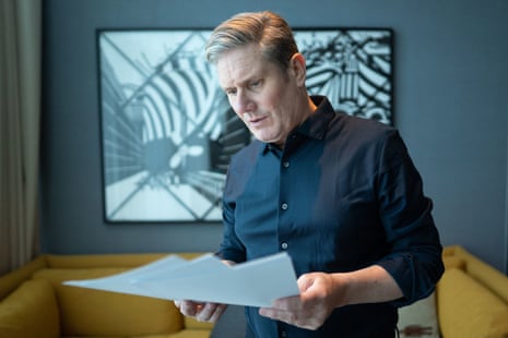 Keir Starmer in his hotel room in Liverpool yesterday checking the conference speech he will deliver this afternoon.