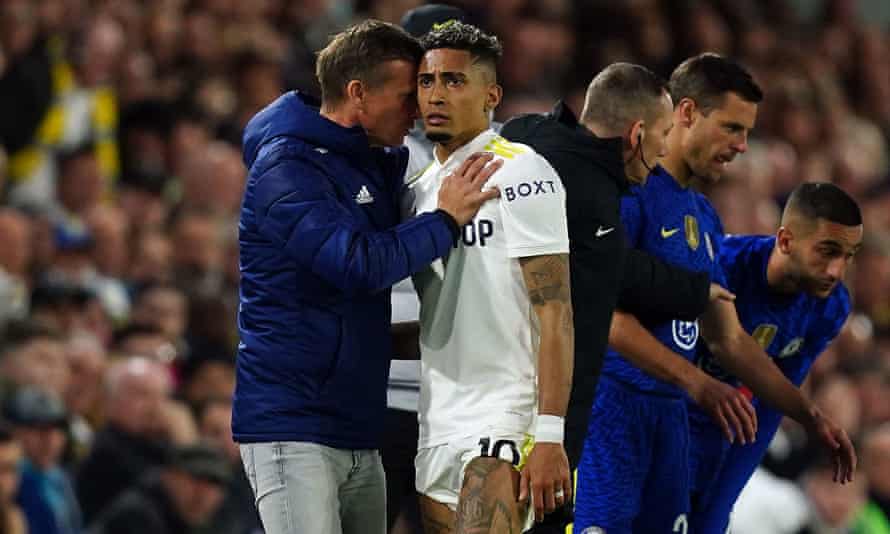 Leeds United manager Jesse Marsch speaks to Rafinha as a substitute.