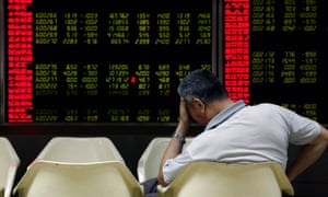 China stock market<br>epaselect epa04895692 An investor reacts while monitoring stock data on an electronic board at a securities brokerage house in Beijing, China, 24 August 2015. The benchmark Shanghai Composite Stock Index dropped more than seven percent on 24 August, trading down on fears of a slowdown in the world’s second-largest economy. The plunge in Chinese equities followed last week’s losses of some 11 percent. EPA/ROLEX DELA PENA