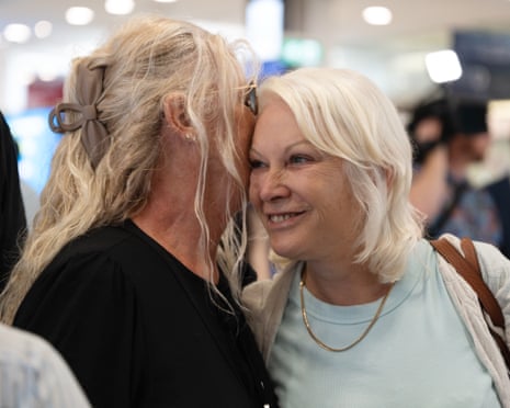 Passengers on a flight from Dubai arrive at Sydney international airport in Sydney on Friday