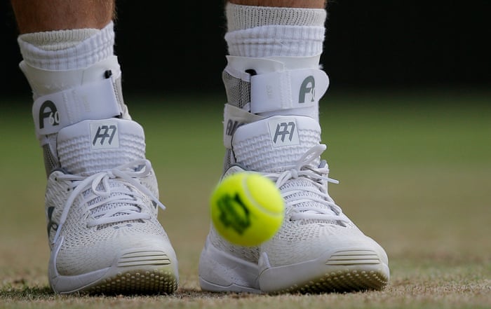 <strong>Day six</strong><br>Andy Murrayu2019s shoes with his wedding ring tied into the laces on his left foot during his match with Andreas Seppi on Centre Court