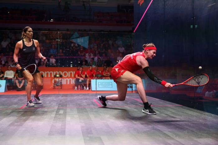England’s Sarah-Jane Perry plays a shot as Joelle King of New Zealand looks on.