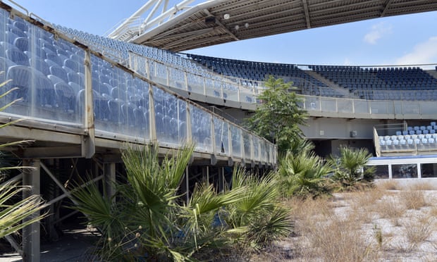 The neglected, overgrown beach volleyball stadium in Athens. Most of the newly constructed stadiums for the 2004 Games now lie abandoned. 