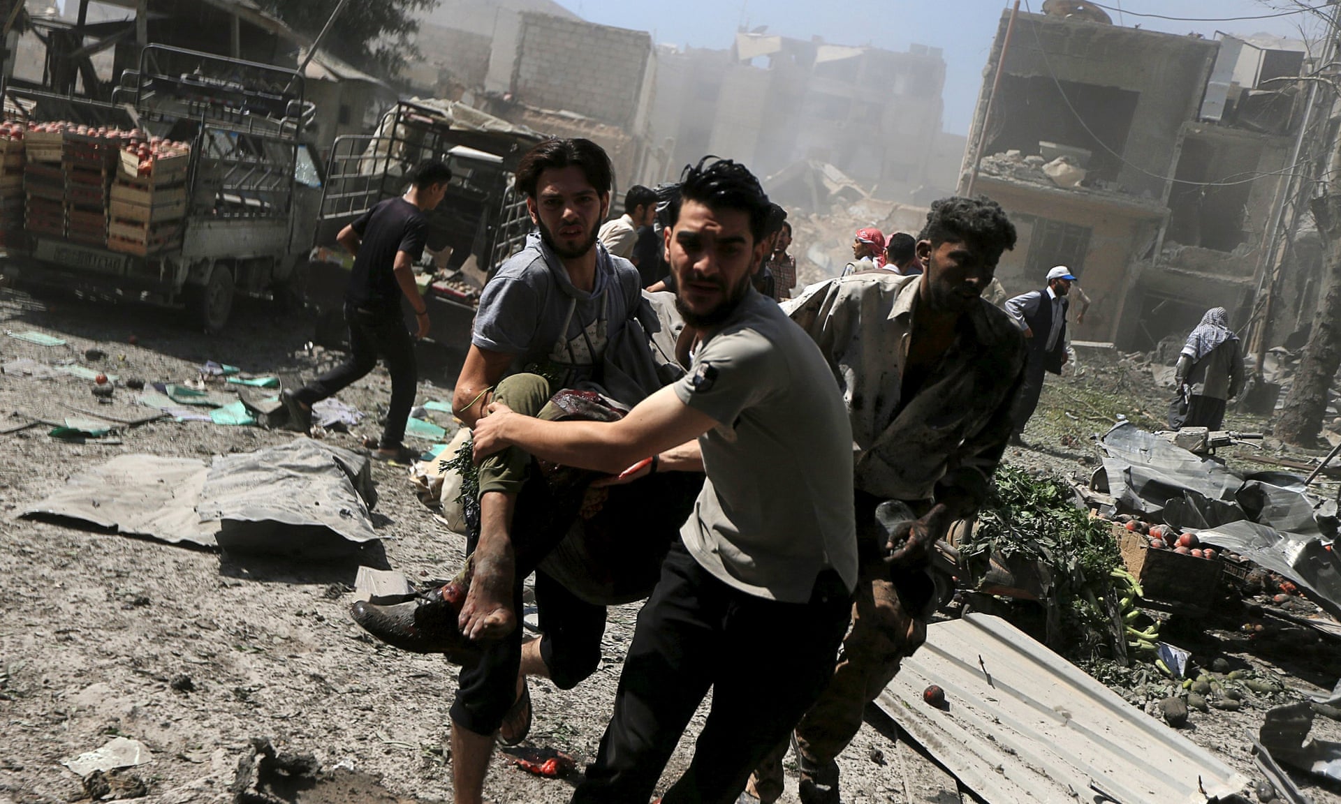 Attack on a market in Douma, Damascus, 12 August: ‘Assad is the cause of Syria’s legitimacy crisis… his barrel bombs and starvation sieges are gifts of incalculable value to Isis.’ Photograph: Bassam Khabieh/Reuters