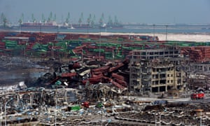 Mangled cargo containers and twisted wreckage at the site of the explosions in Tianjin. 