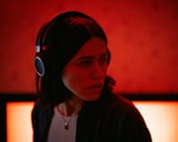 person wearing headphones turns around