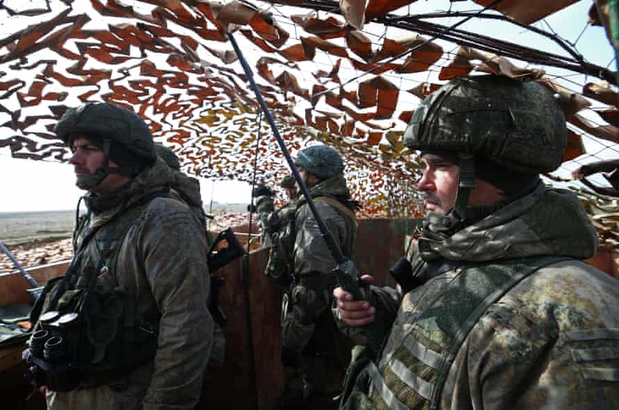Russian soldiers are seen at the command post during exercises conducted by Russian Airborne Troops troops in the Opk Mountains.