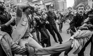 Press photographers capture the arrest of an anti-racist demonstrator