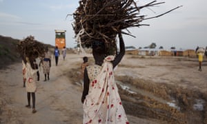 A young woman en route to the UN base outside Bentiu in Unity state, South Sudan, after collecting firewood