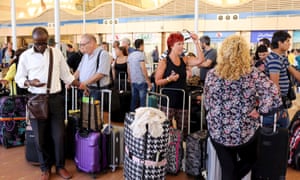 Passengers, including British nationals, wait at the airport in Sharm el-Sheikh after their flight was cancelled.