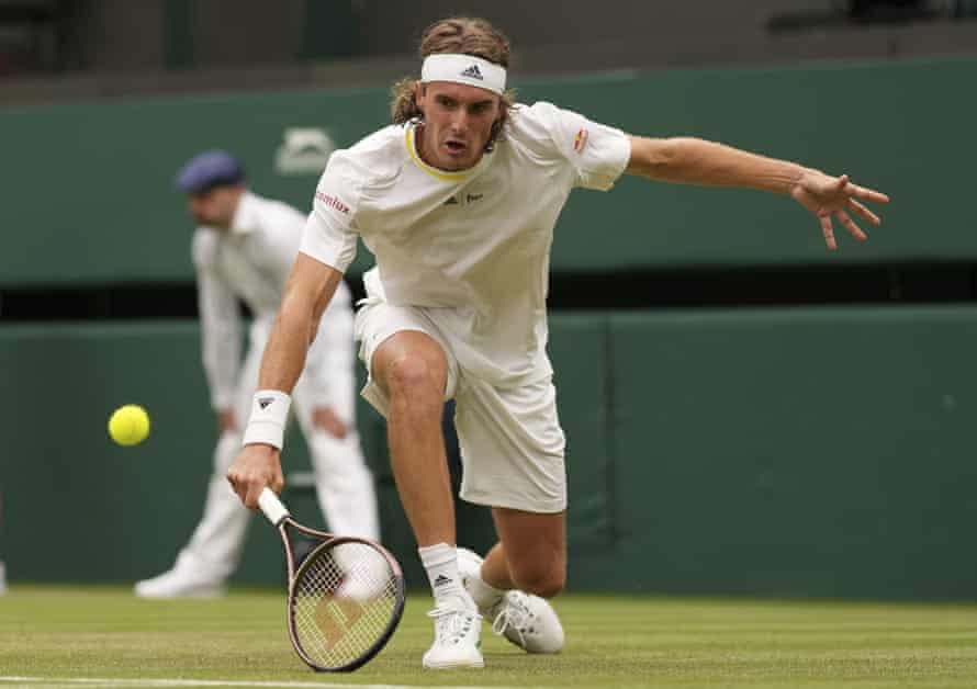 Stefanos Tsitsipas hits a low return.