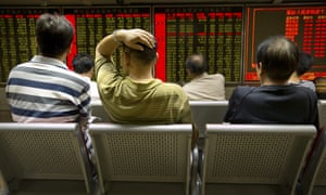 Chinese investors monitor stock prices at a brokerage house in Beijing.