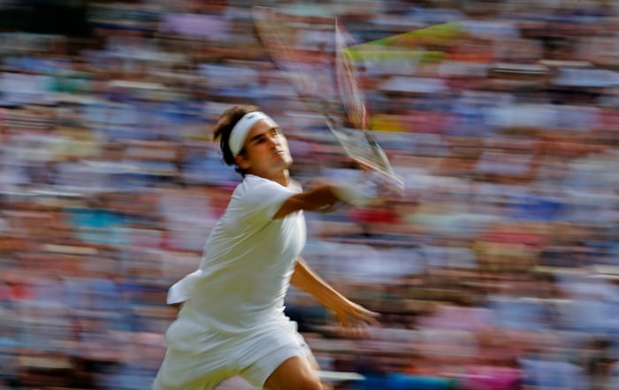 <strong>Day eleven</strong><br>Roger Federer volleys during his semi-final match with Andy Murray on Centre Court