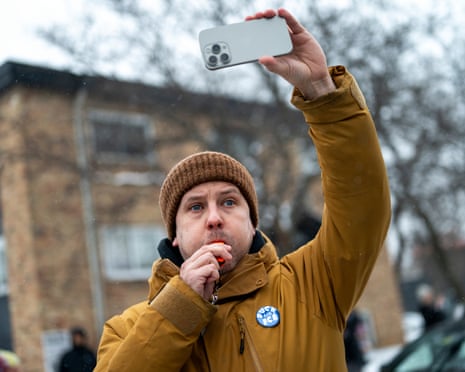 a man blowing a whistle a recording with his phone