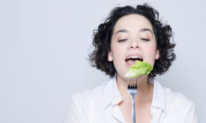 Woman eating salad