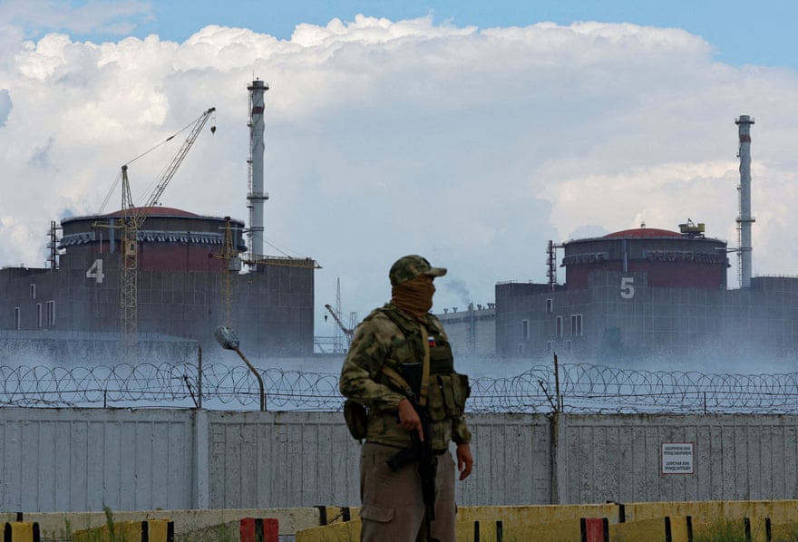 A Russian soldier stands guard near the Zaporizhzhia nuclear power plant, outside the Russian-held town of Enerhodar.