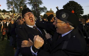 Members of the Shotts and Dykehead Caledonia react to winning the annual World Pipe Band Championships in Glasgow.
