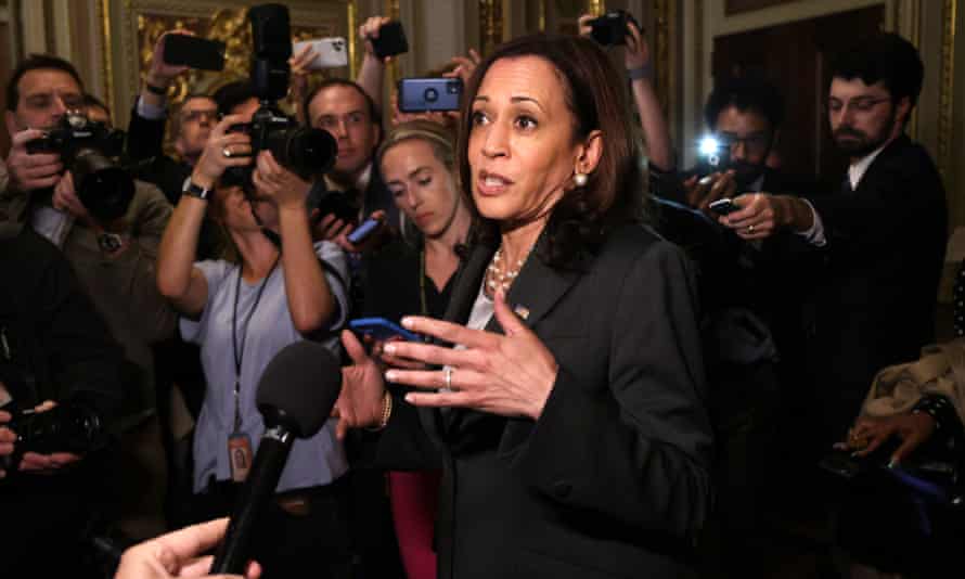 Kamala Harris speaks with members of the media after presiding over the vote.