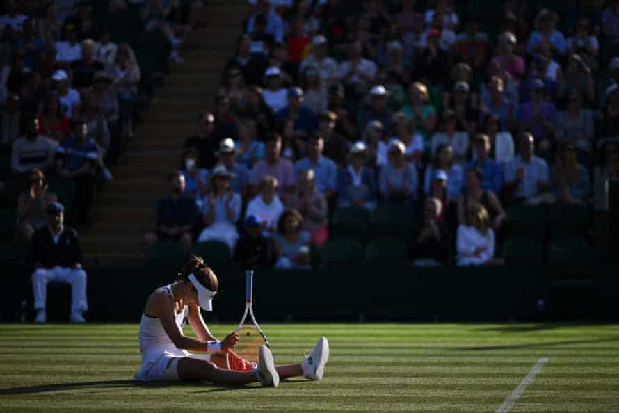 Cornet sits looking dejected on the court.