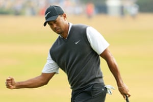 Tiger Woods reacts to a birdie.