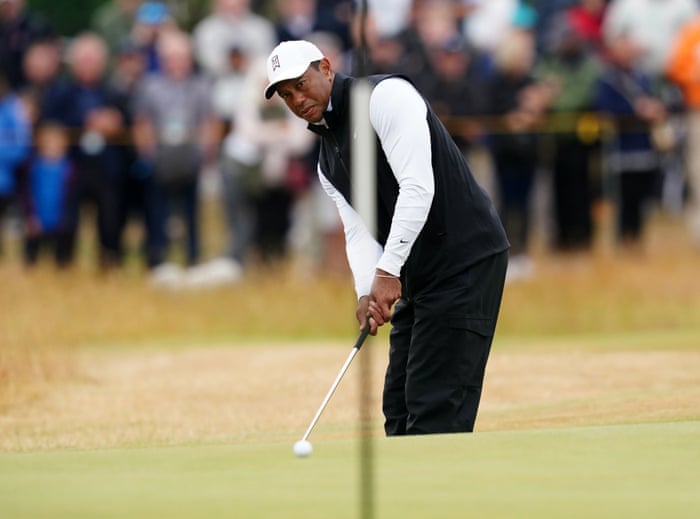 Tiger Woods putts on the 4th.