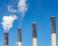 Emissions rise from smokestacks