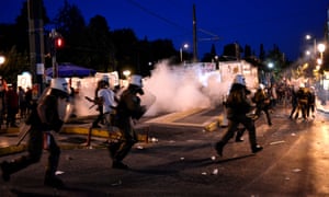 Riot police use teargas outside the Greek parliament