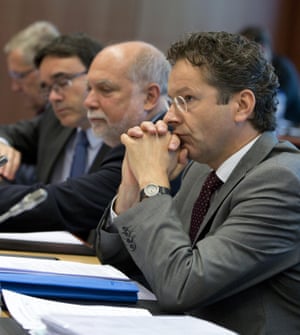 Dutch Finance Minister Jeroen Dijsselbloem, right, waits for the start of a meeting of eurogroup finance ministers in Brussels on Saturday, June 27, 2015. Anxiety over Greece’s future swelled on Saturday after Prime Minister Alexis Tsipras’ call to have the people vote on a proposed bailout deal increased the risk that the country might fall out of the euro. (AP Photo/Virginia Mayo)